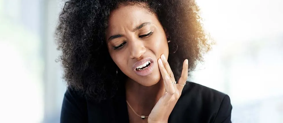 Woman experiencing tooth pain