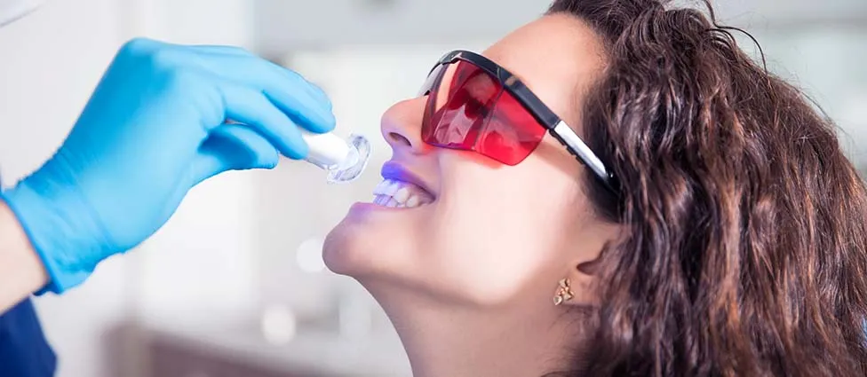 Woman undergoing teeth whitening